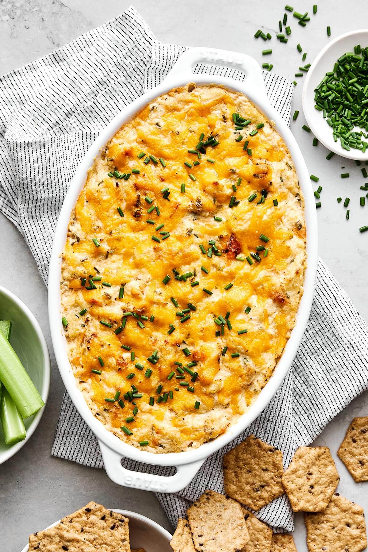 A white baking dish of crab dip.