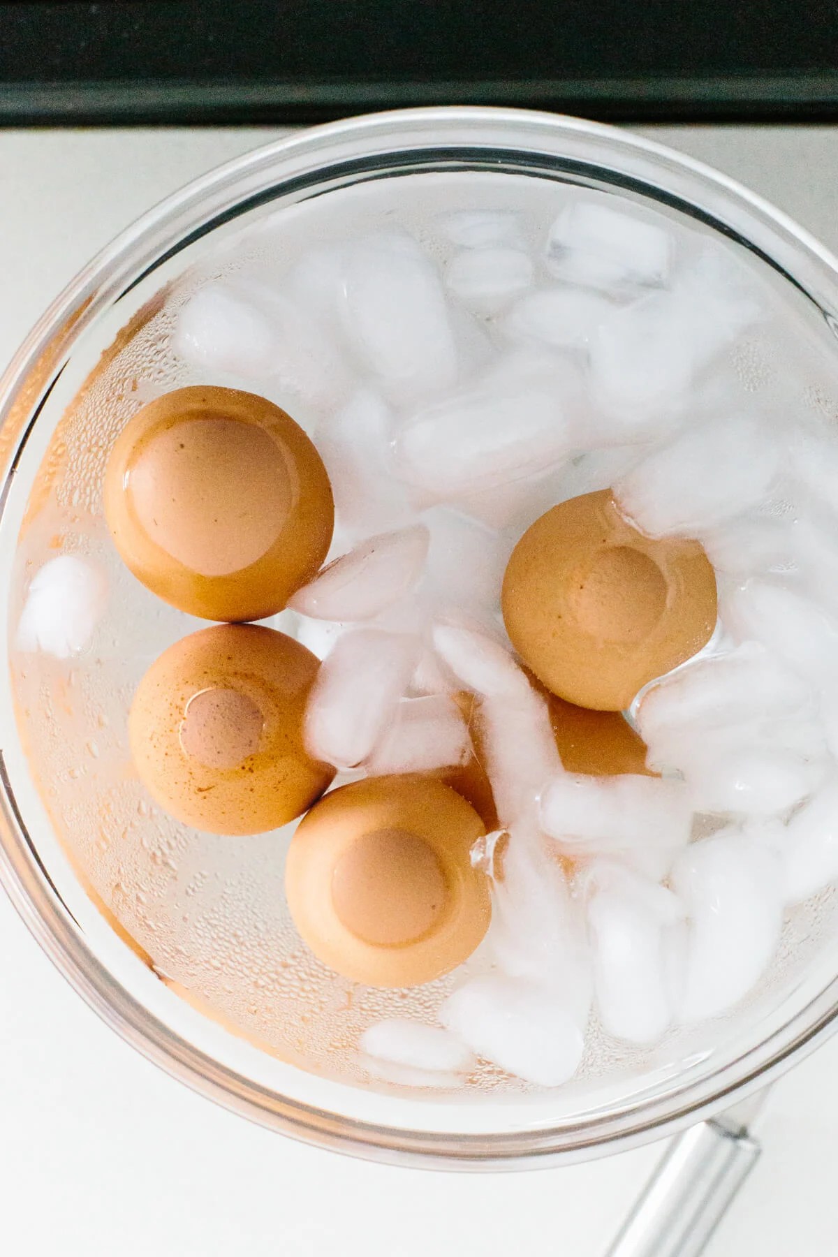 Hard boiled eggs in an ice water bath.