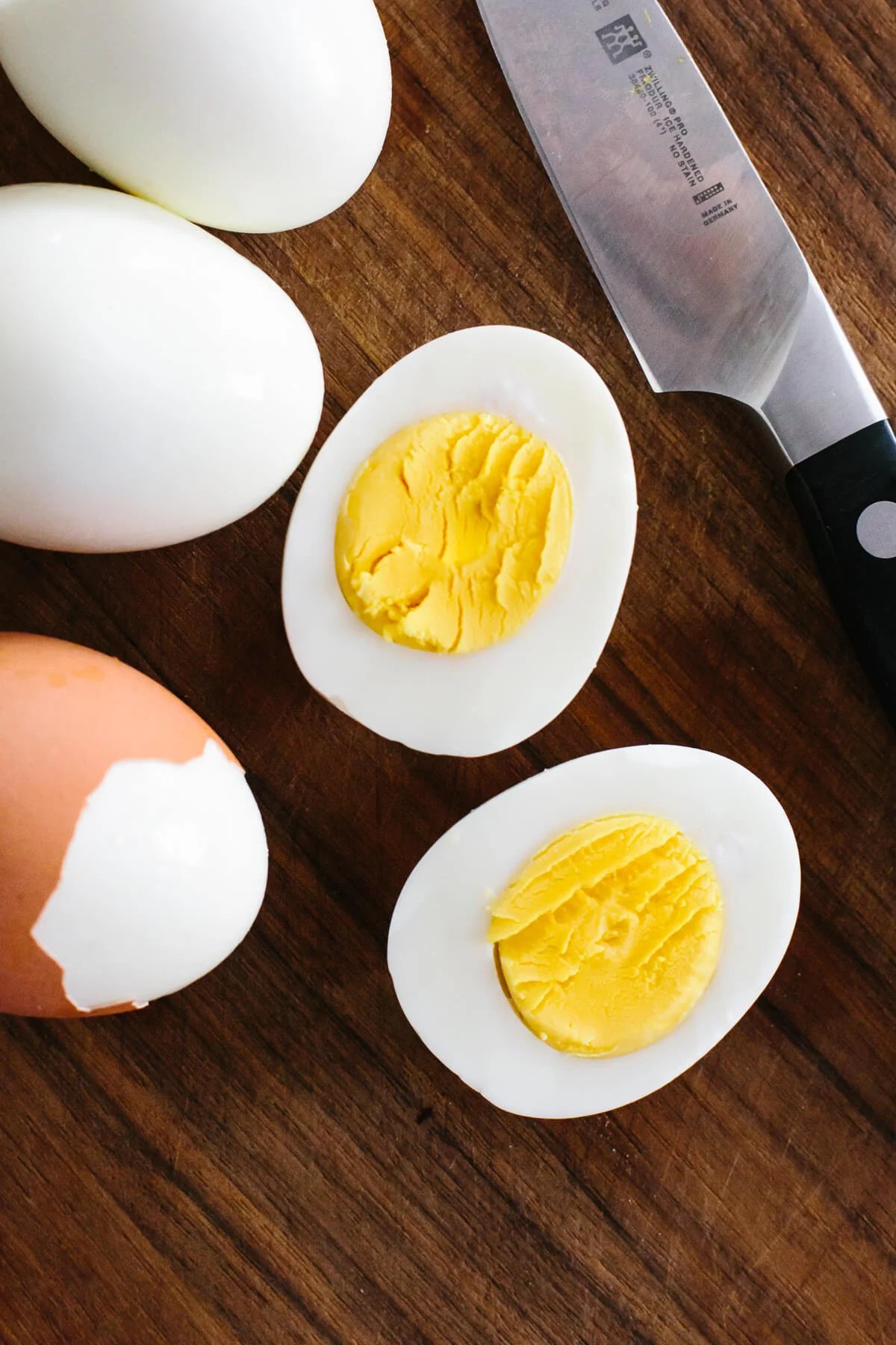 Slicing hard boiled eggs in half.