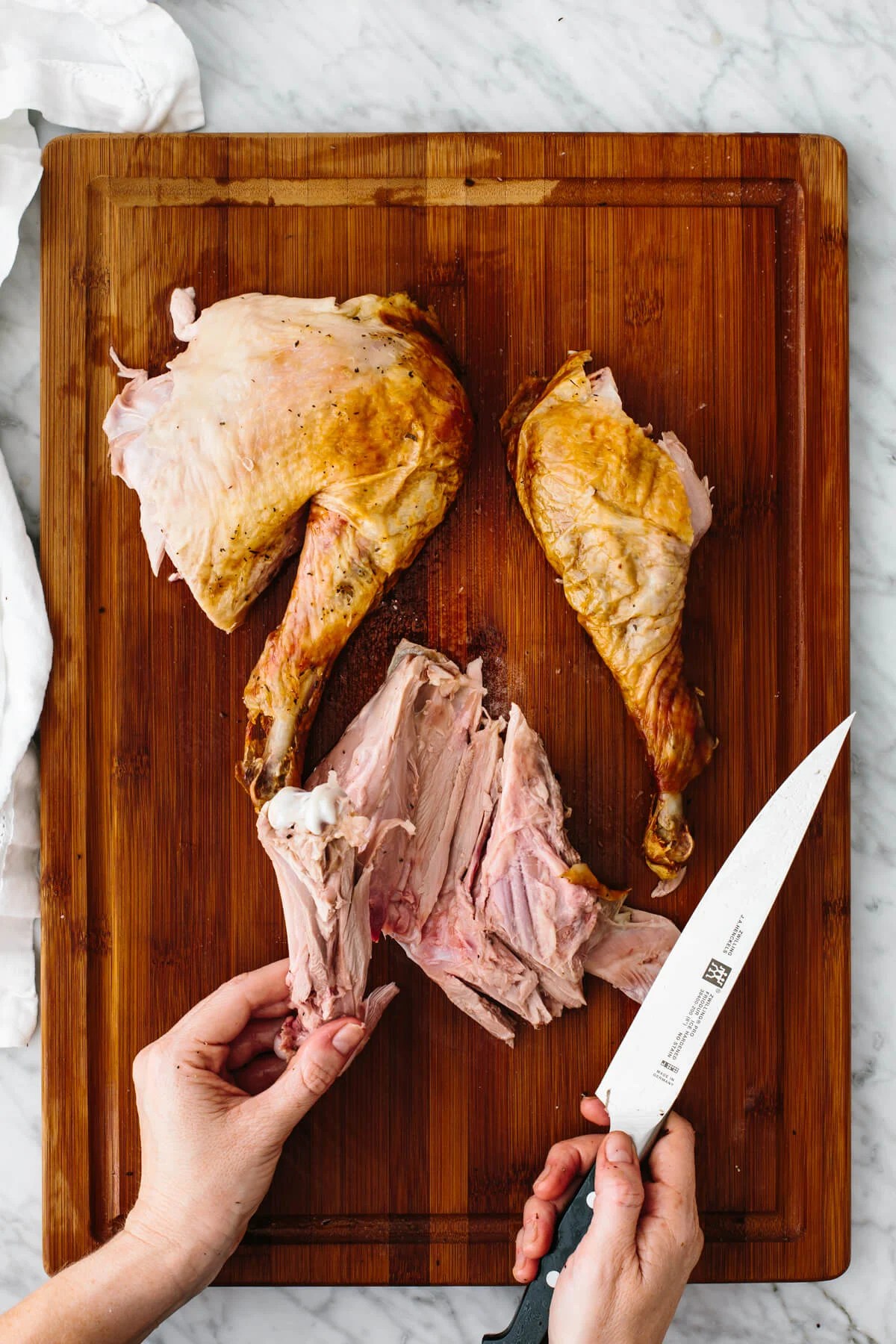 Carving out the wing from a Thanksgiving turkey