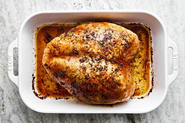 A baking dish with garlic herb butter.