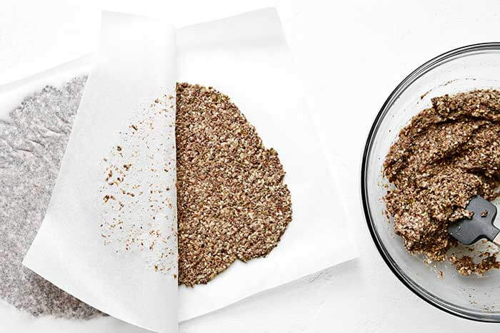 Rolling out seed cracker dough.