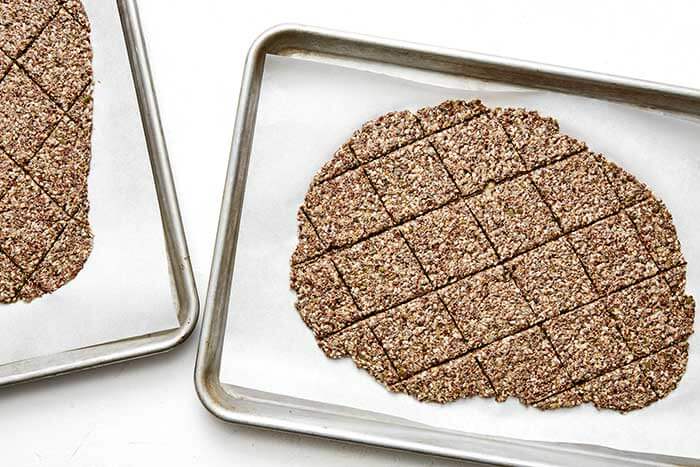 Seed cracker dough on a sheet pan.