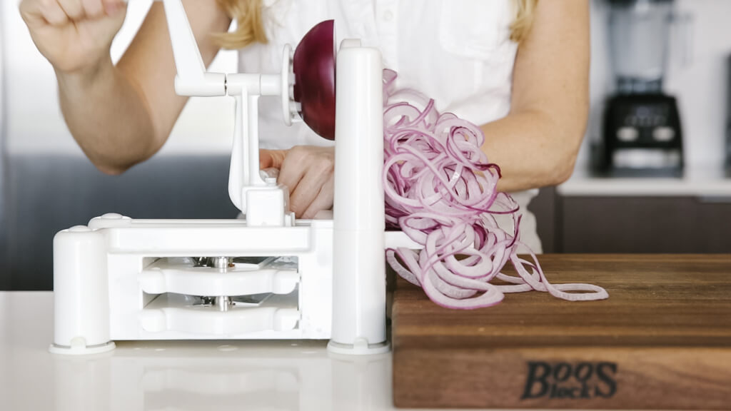 The spiralizer is one of my favorite kitchen tools. So today I'm sharing my favorite vegetables to spiralize along with veggie spiralizer tips and recipes. Learn how to spiralize red onion.