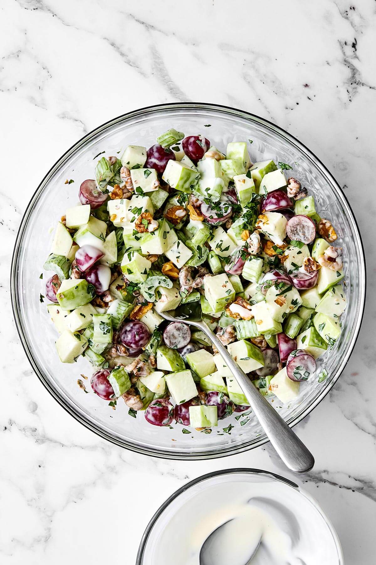 Waldorf salad in a glass bowl.